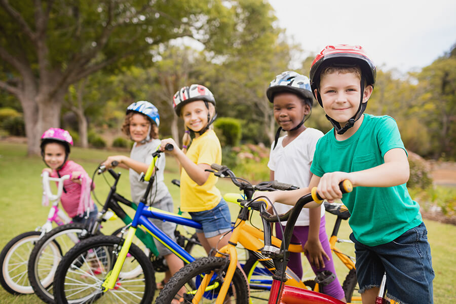 kids smiling on bikes